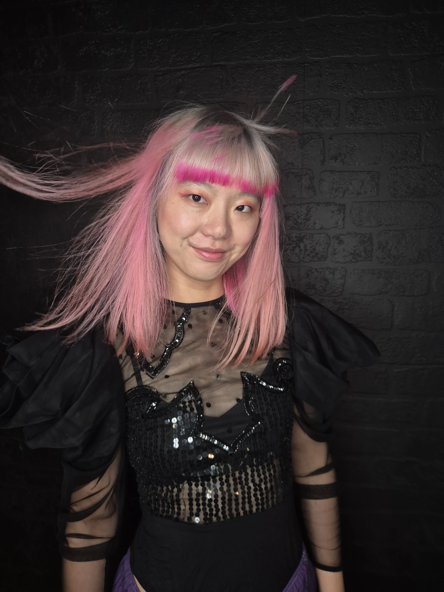 Creative pink hair colour with vivid pink fringe created at Oliver Stephens in Soho