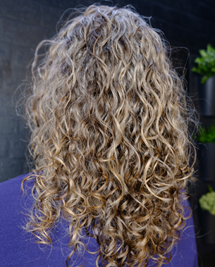long curly brown hair from back