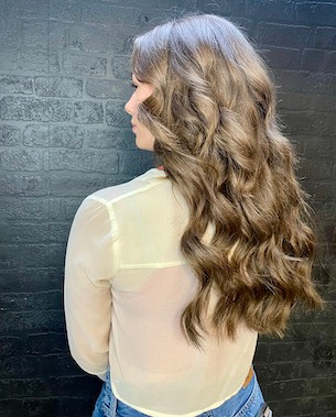 model with long wavy brown hair down back